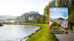 Ein Weg an der Salzach in Salzburg mit einem Cover der Zeitschrift Merian Salzburg auf der rechten Seite.